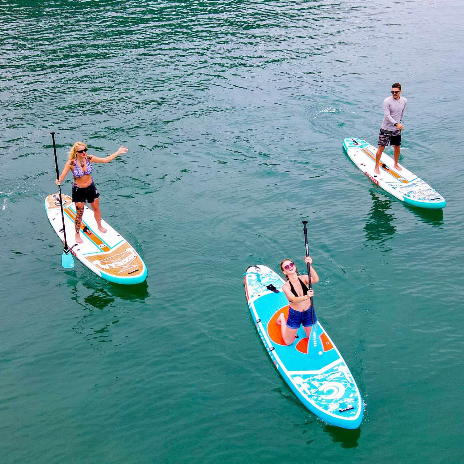 play paddle board with friends